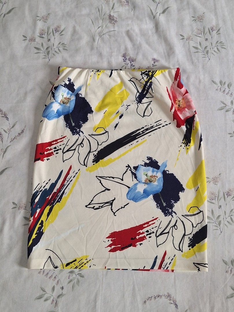 Abstract Floral Print Skirt (Category: Scarves) located in Taguig. Submitted by butterflypea.thrift (Listing ID 1461063193, Image 2). Description: - Cream-colored skiry - Vibrant abstract floral print - Features bold splashes of red, yellow, and navy blue - Includes black line art flowers - Perfect for adding a pop of color to any outfit.