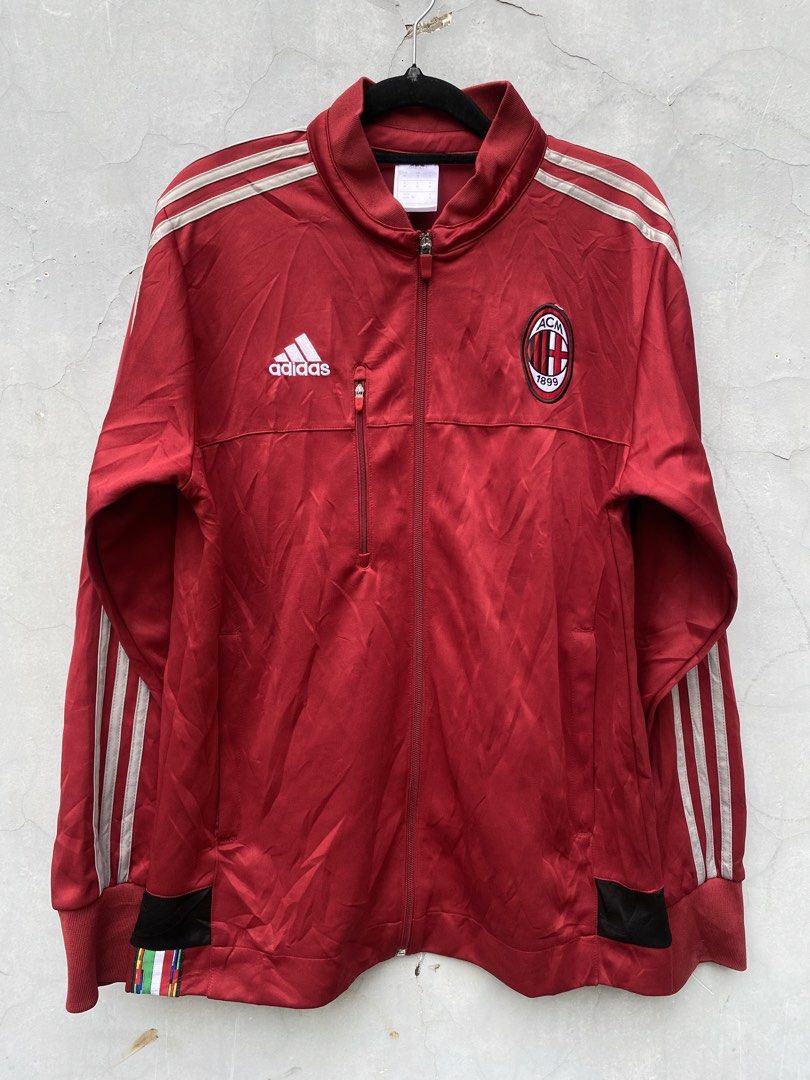 Adidas AC Milan Track Jacket Red (Category: Coats, Jackets and Outerwear) located in Puerto Princesa. Submitted by 4stylefit (Listing ID 1461026467, Image 1). Description: - Authentic Red Adidas Track Jacket - Features AC Milan Crest - Classic Three Stripes on Sleeves - Convenient Zippered Chest Pocket - Made in Thailand - Size: Medium.