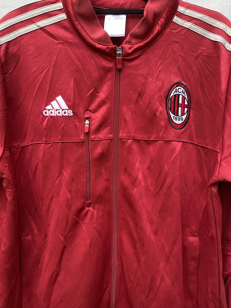 Adidas AC Milan Track Jacket Red (Category: Coats, Jackets and Outerwear) located in Puerto Princesa. Submitted by 4stylefit (Listing ID 1461026467, Image 2). Description: - Authentic Red Adidas Track Jacket - Features AC Milan Crest - Classic Three Stripes on Sleeves - Convenient Zippered Chest Pocket - Made in Thailand - Size: Medium.