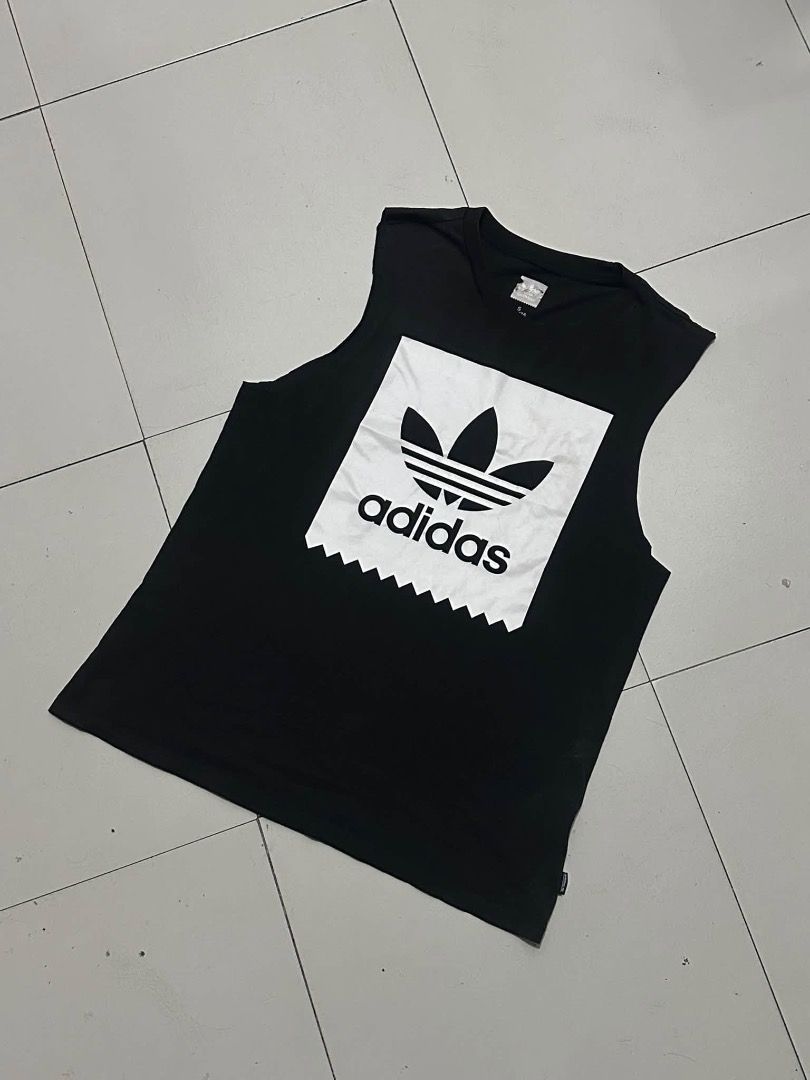 Adidas black muscle tee (Category: Tshirts & Polo Shirts ) located in Manila. Submitted by nb_thriftshop (Listing ID 1461080015, Image 1). Description: adi muscle tee 25 length 19 width height 5'5 weight 65 kg medium no issue need wash.