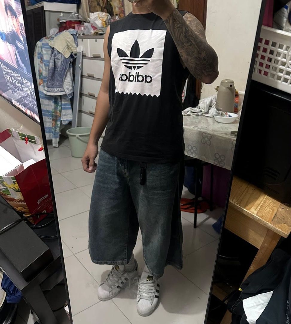 Adidas black muscle tee (Category: Tshirts & Polo Shirts ) located in Manila. Submitted by nb_thriftshop (Listing ID 1461080015, Image 3). Description: adi muscle tee 25 length 19 width height 5'5 weight 65 kg medium no issue need wash.