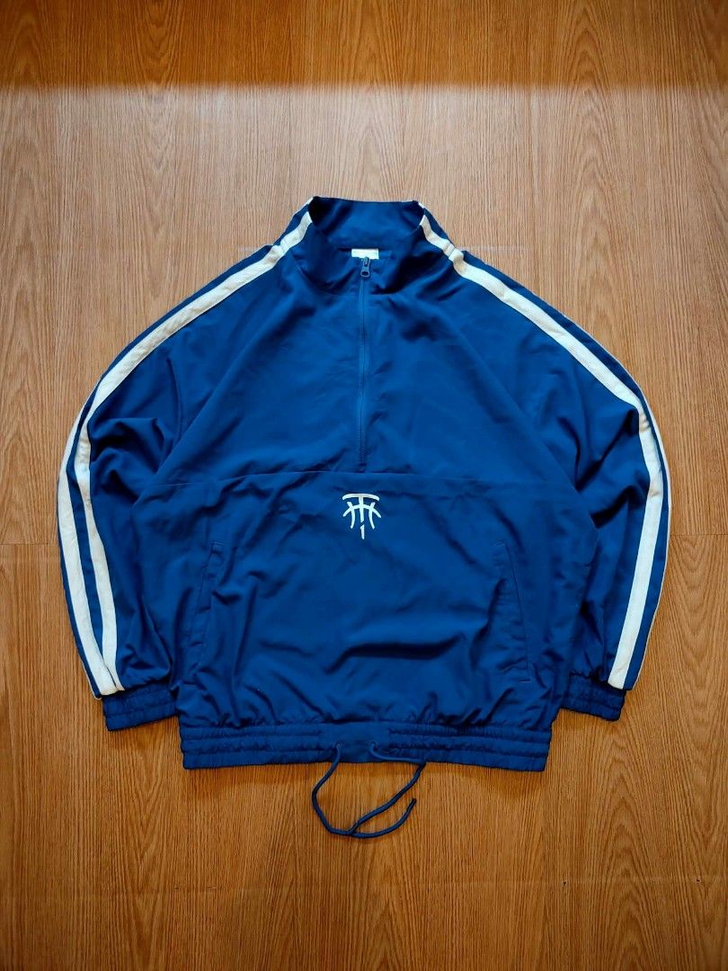 Adidas Blue Track Jacket with White Stripes (Category: Coats, Jackets and Outerwear) located in Muntinlupa City. Submitted by thegoodthriftph (Listing ID 1460940664, Image 2). Description: - Classic blue Adidas track jacket - Iconic white three stripes on sleeves - Half-zip closure with stand-up collar - Elasticated cuffs and hem with drawstring - Small embroidered Adidas logo on front - Ideal for casual wear or sports activities.