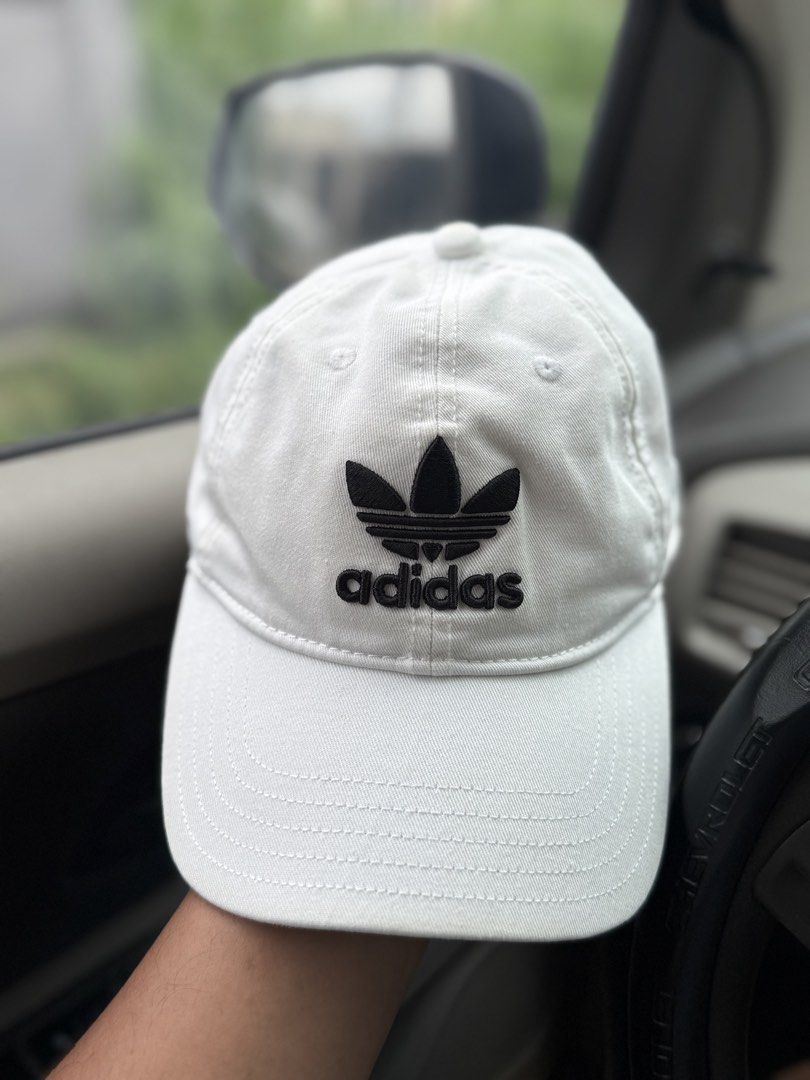 Adidas Cap White with Black Logo (Category: Caps & Hats) located in Bacolod City. Submitted by kitcarsonduff (Listing ID 1461097827, Image 1). Description: - Classic white Adidas cap - Features iconic black trefoil logo - Adjustable strap for a comfortable fit - Simple and versatile for everyday wear - Matches any outfit.