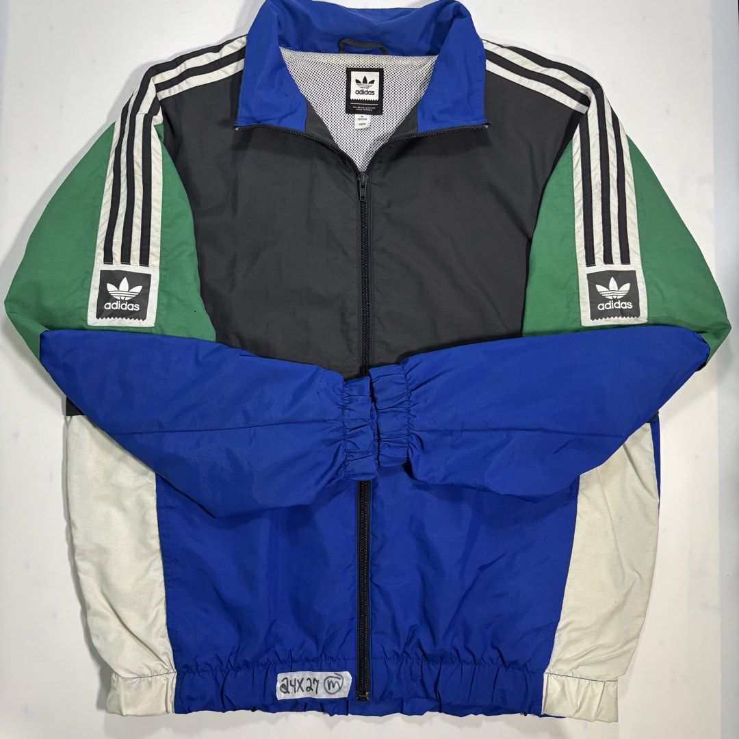 Adidas Colorblock Track Jacket (Category: Coats, Jackets and Outerwear) located in Cavite. Submitted by sidirvinp76902 (Listing ID 1460961636, Image 1). Description: - whit issue tiny pinholes but still in excellent condition ganda nito! Cool Adidas track jacket - Bold colorblock design: green, black, and blue panels - Classic three stripes on sleeves - Adidas trefoil logo on chest and sleeves - Zipper closure - Great for casual wear.