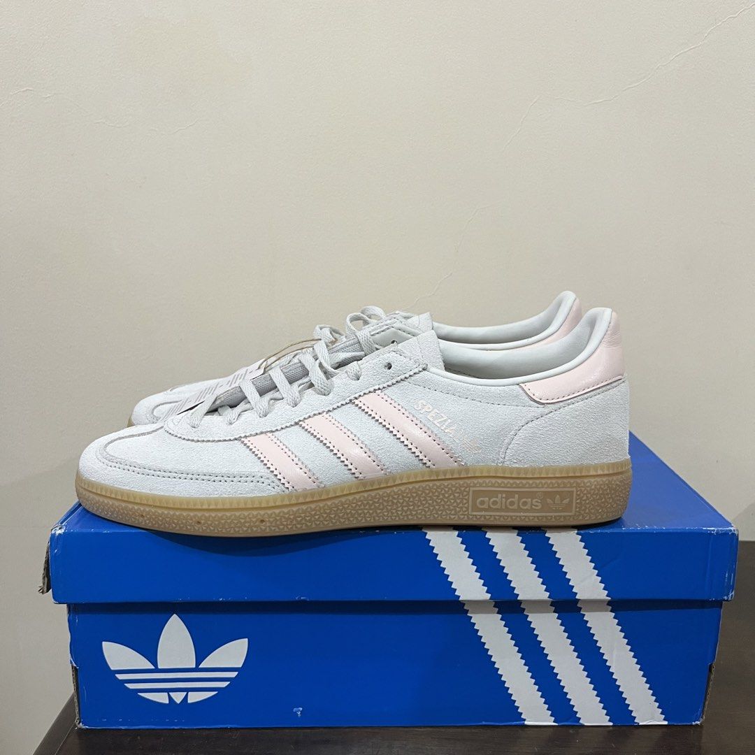 Adidas Handball Spezial W (Category: Sneakers) located in Paranaque City. Submitted by edf092579 (Listing ID 1461111458, Image 2). Description: - Adidas Handball Spezial W sneakers - Color: Light grey with pink stripes and heel tab - Sole: Gum sole - Condition: Comes with original box - Size: US Women's 9.5 US Men’s 8.5 Shipping fee will be shouldered by the buyer.