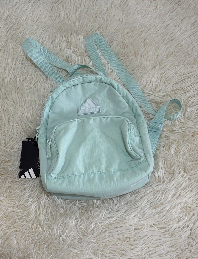 Adidas Mini Backpack Mint Green Nylon (Category: Backpacks) located in Manila. Submitted by calmstone_aaeaa3 (Listing ID 1460979077, Image 1). Description: - Cute mint green Adidas mini backpack - Made of 100% nylon - Main compartment with inner zip pocket - Front zip pocket - Ideal for carrying essentials - Perfect size for everyday use - Brand new with tags attached.