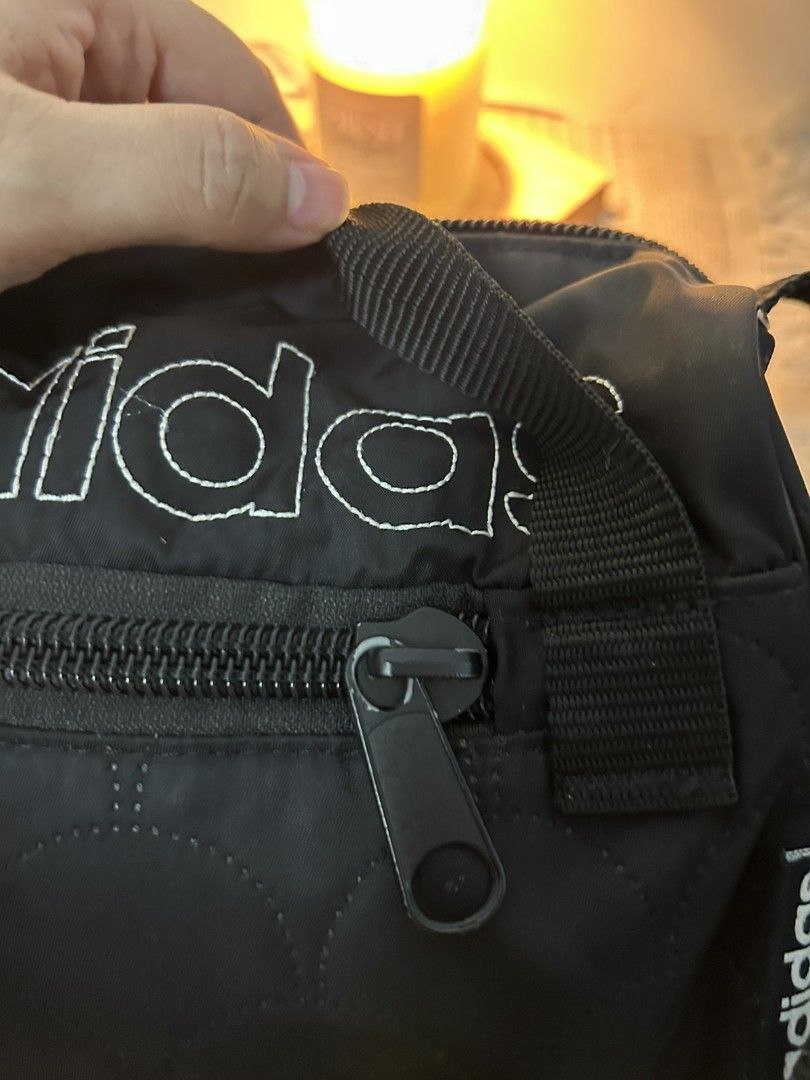 Adidas Mini Duffel Bag Black (Category: Cross-body Bags) located in San Pablo. Submitted by anicahclosetonlineshop (Listing ID 1460941600, Image 2). Description: Adidas mini duffle bag small size with minimal signs of usage sa zipper what you see is what you get with sling zipper closure zipper pocket payment first via gcash or bank transfer.