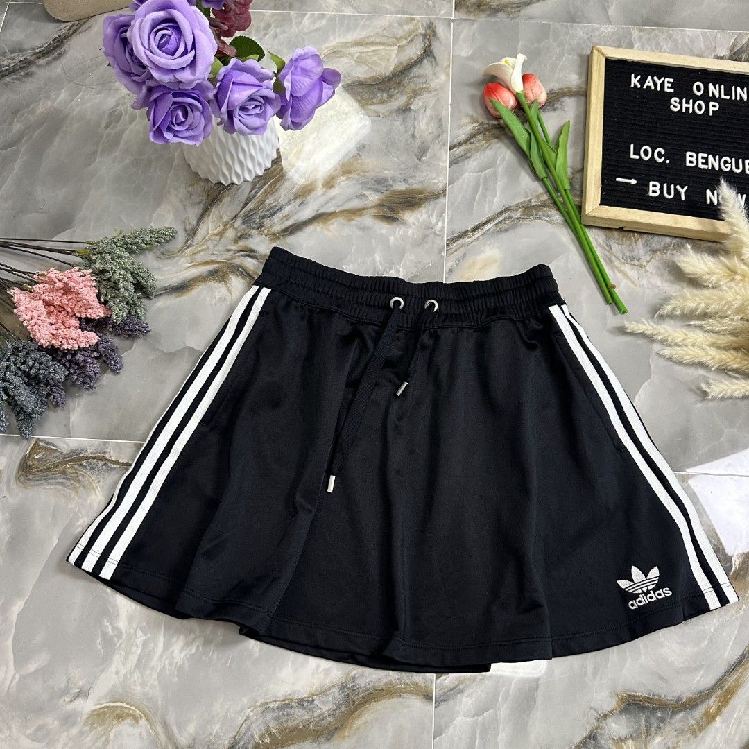 Adidas MiniSkirt (Category: Skirts) located in Baguio. Submitted by kayeonlineshop (Listing ID 1461000799, Image 1). Description: black Adidas Originals mini skirt featuring the iconic white 3-Stripes and a drawstring waist w-max 32 l 16 H64.