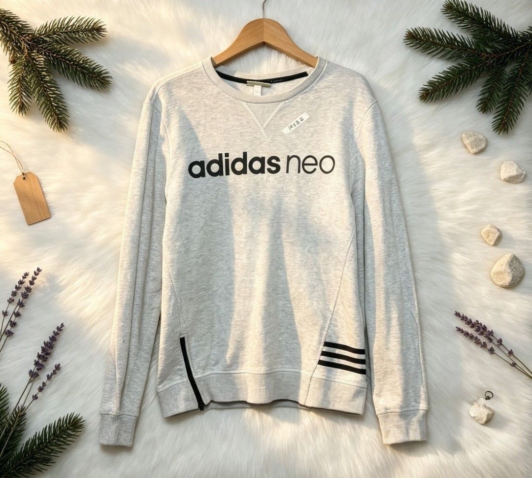 Adidas Neo Grey Sweatshirt (Category: Coats, Jackets and Outerwear) located in Manila. Submitted by momofunodos (Listing ID 1460963634, Image 1). Description: - Grey Adidas Neo sweatshirt - Features Adidas Neo logo on front - Subtle design details on sides and sleeves - Ribbed cuffs and hem - Perfect for casual wear.