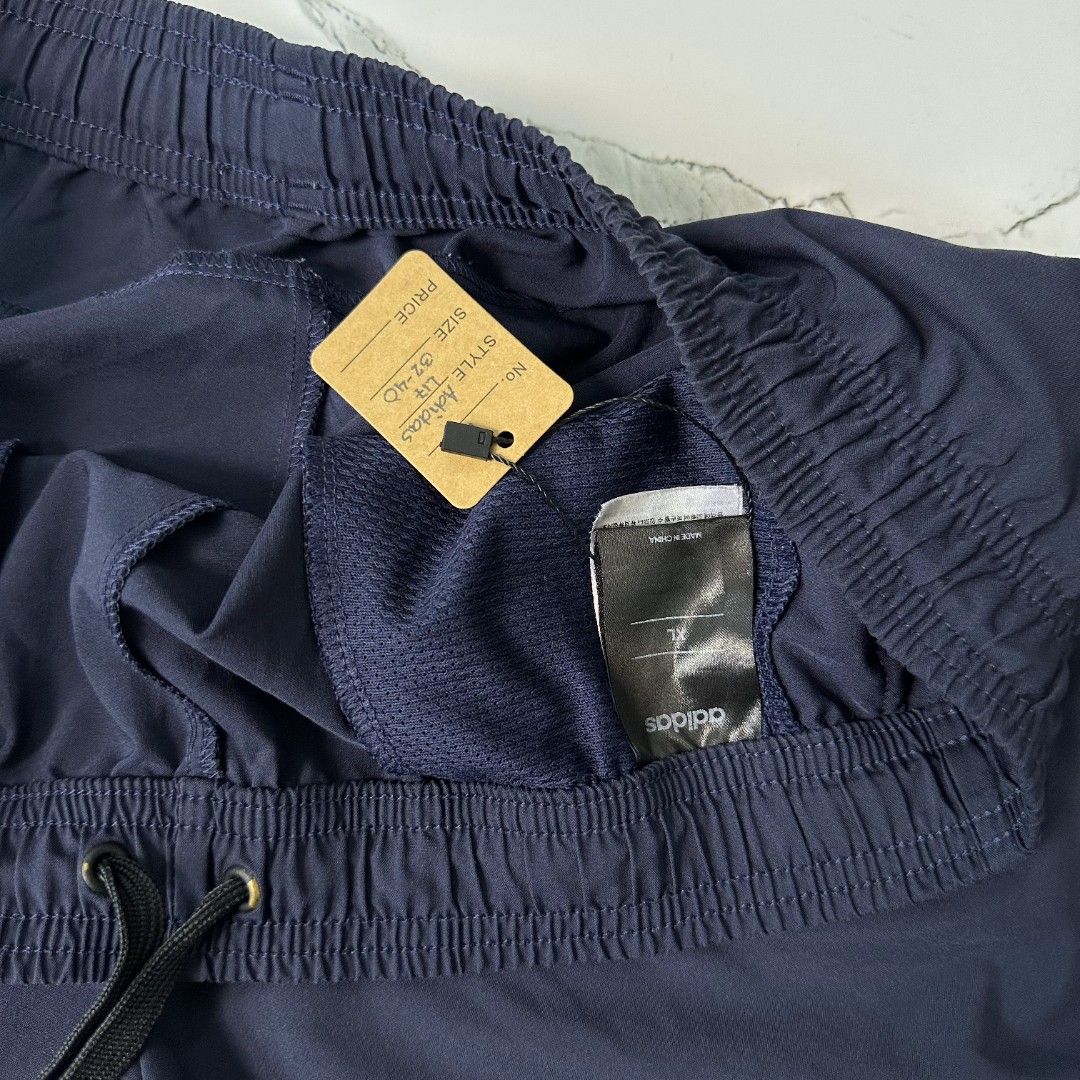 Adidaz Navy Shorts (Category: Shorts) located in Baguio. Submitted by kayeonlineshop (Listing ID 1461018194, Image 2). Description: navy blue Adidas Essentials Plain Chelsea Shorts featuring an elastic waistband and a small white Adidas logo on the left leg l17 w32-40 h26.
