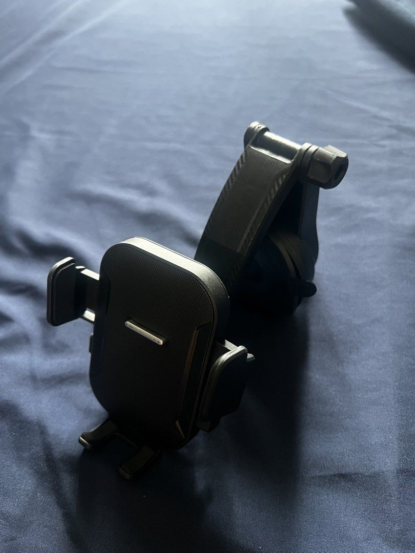 Adjustable Car Phone Holder Mount (Category: Mounts & Holders) located in Quezon City. Submitted by hhkbczjsg7 (Listing ID 1460952158, Image 1). Description: Universal car phone mount. Fits most phones. Mounts on windshield/dashboard. Adjustable for best view. Easy to use..