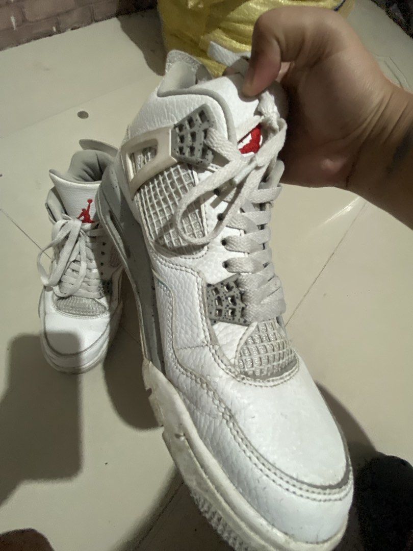 Air Jordan 4 Retro White Cement (Category: Sneakers) located in Manila. Submitted by jellybbean (Listing ID 1461009938, Image 2). Description: - Classic white and grey Air Jordan 4 colorway. - size: 8 - 8.5 for men - Laces show some wear. - Soles have minor dirt. - Still a solid pair for everyday use. - Grab these iconic sneakers!.