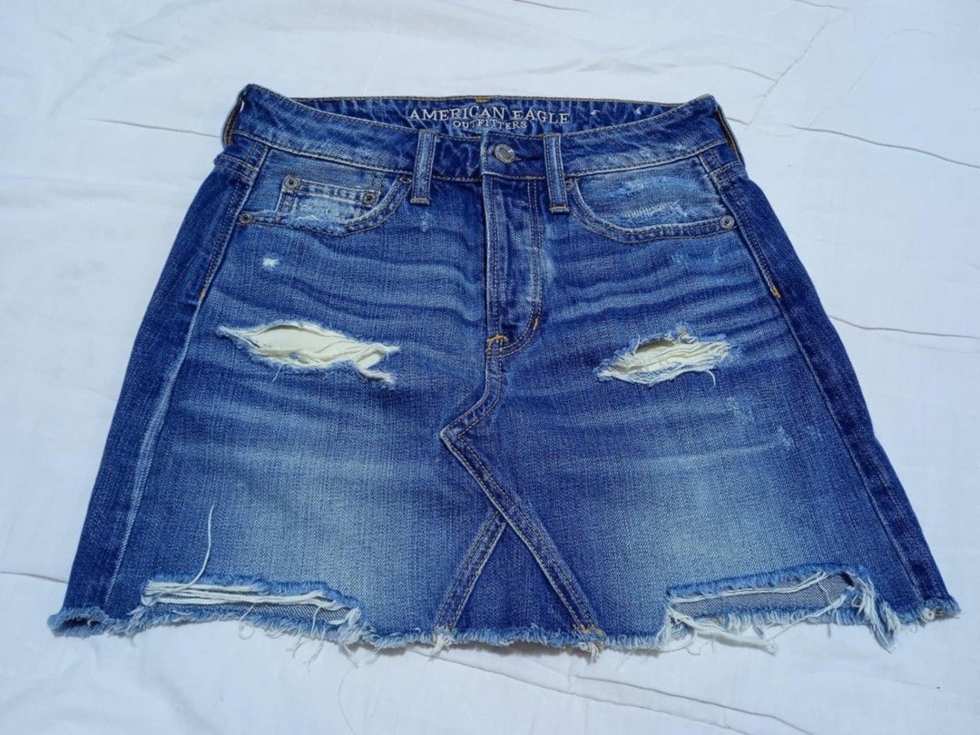 American Eagle Denim Mini Skirt (Category: Skirts) located in Manila. Submitted by dear__riri__ (Listing ID 1460976235, Image 1). Description: - American Eagle blue denim mini skirt - Features rips and distressed details - Raw hemline - Classic 5-pocket styling - Ideal for casual wear.