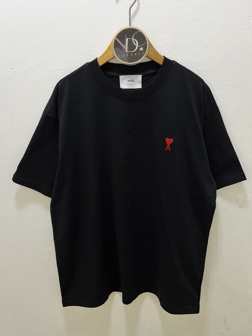AMI Paris t-shirt Mens (Category: Luxury Apparel) located in Imus. Submitted by vdc.apparel (Listing ID 1460921017, Image 1). Description: This black AMI Paris t-shirt features the signature red embroidered Ami de Coeur heart logo on the chest. Almost Brandnew never worn Size M on tag best fit to Mens Large Womens best fit to XL .