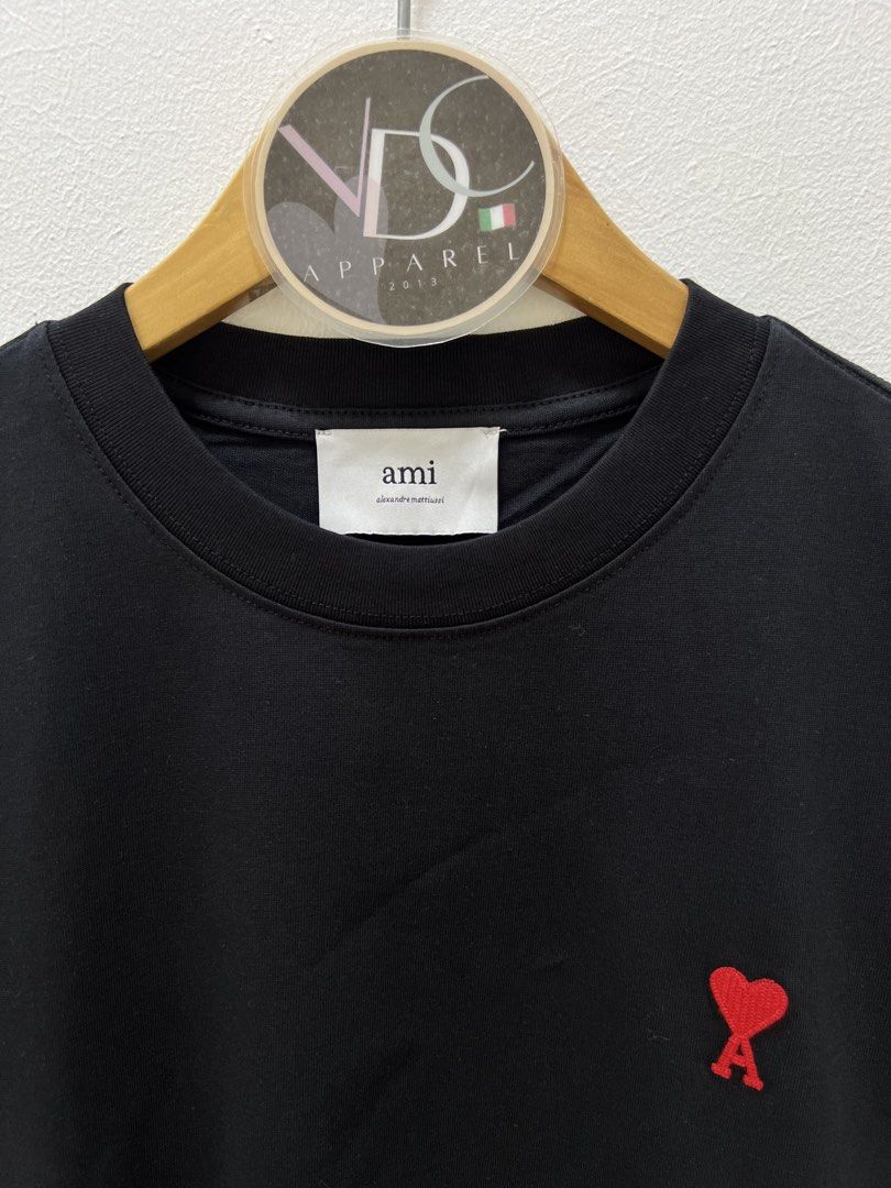AMI Paris t-shirt Mens (Category: Luxury Apparel) located in Imus. Submitted by vdc.apparel (Listing ID 1460921017, Image 2). Description: This black AMI Paris t-shirt features the signature red embroidered Ami de Coeur heart logo on the chest. Almost Brandnew never worn Size M on tag best fit to Mens Large Womens best fit to XL .