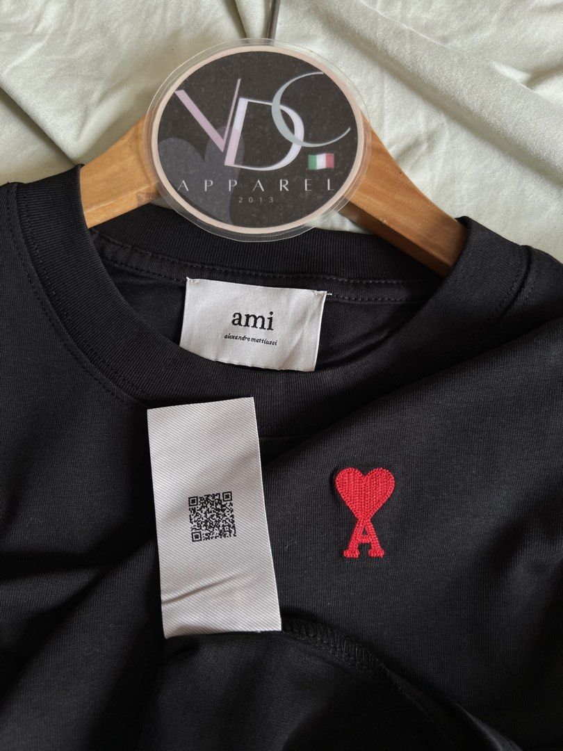 AMI Paris t-shirt Mens (Category: Luxury Apparel) located in Imus. Submitted by vdc.apparel (Listing ID 1460921017, Image 3). Description: This black AMI Paris t-shirt features the signature red embroidered Ami de Coeur heart logo on the chest. Almost Brandnew never worn Size M on tag best fit to Mens Large Womens best fit to XL .