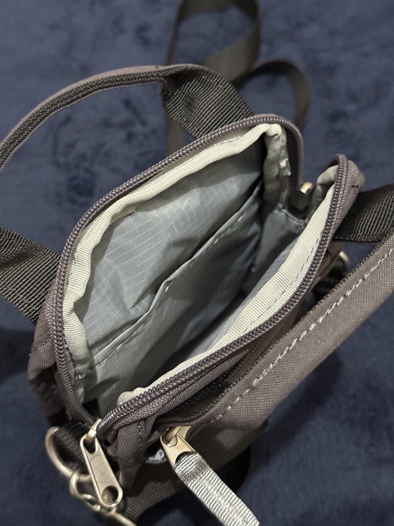 Anello Canvas Crossbody Bag Dark Grey (Category: Cross-body Bags) located in Batangas. Submitted by cathevans (Listing ID 1460977467, Image 3). Description: - Anello crossbody bag in dark grey canvas - Main zippered compartment with inner pockets - Front zippered pocket for quick access - Two top handles for versatile carrying - Adjustable shoulder strap for comfort - Ideal for everyday use and carrying essentials.