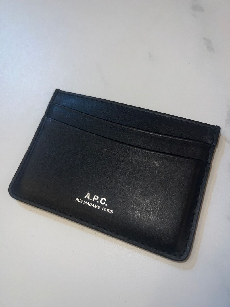 A.P.C. André Cardholder (Category: Wallets & Card holders) located in Pasig City. Submitted by sqfund (Listing ID 1461036691, Image 2). Description: - Authentic A.P.C. André Cardholder card holder - Bought at A.P.C. Powerplant - Minimal signs of use (check photos) - Two card slots on one side and one on the other. - Silvertone embossed 'A.P.C. Rue Madame Paris' logo - Dimensions: 10 x 7 cm ✨Excellent condition✨ ___________________________________
