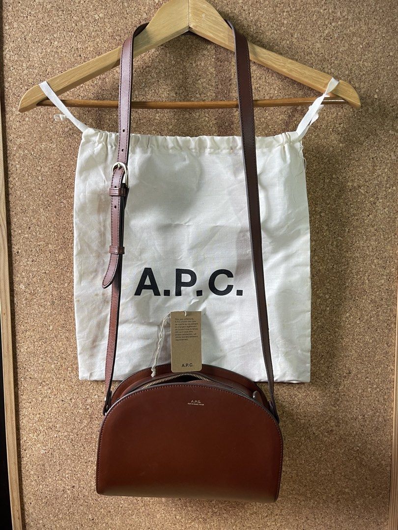 A.P.C. Demi-Lune Bag Brown Leather (Category: Luxury Bags & Wallets) located in Pasig City. Submitted by 3toddlers (Listing ID 1461113565, Image 1). Description: Letting go of my pre-loved bags I bought this at the store, authentic APC - Classic A.P.C. Demi-Lune bag - Material: Rich brown leather - Closure: Zip - Strap: Adjustable shoulder strap - Design: Iconic half-moon shape - Includes: Original dust bag - Ideal for: Everyday use - minimal scr