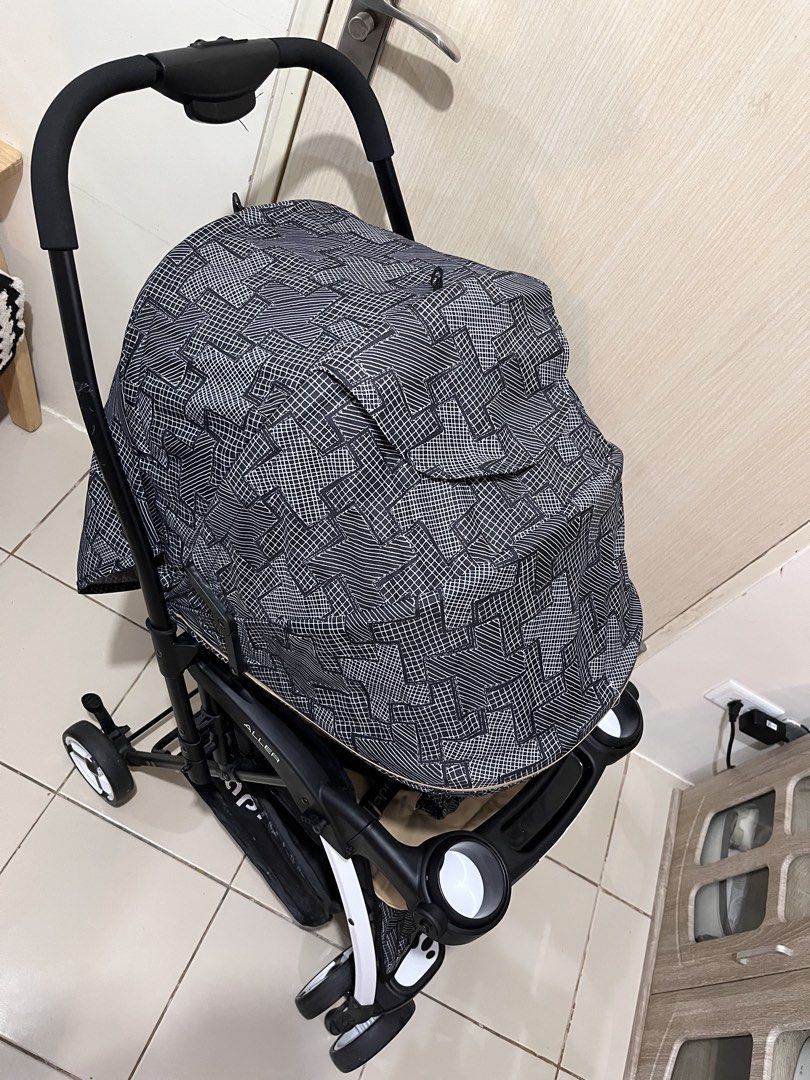 Apruva Aller Reversible Stroller (Category: Strollers) located in Caloocan City. Submitted by cess_sesa (Listing ID 1460937933, Image 3). Description: - Apruva Aller stroller - Tan seat with black and white patterned canopy and basket - Features a 5-point harness for safety - Includes a convenient cup holder - Folds easily for compact storage - Ideal for parents on the go.