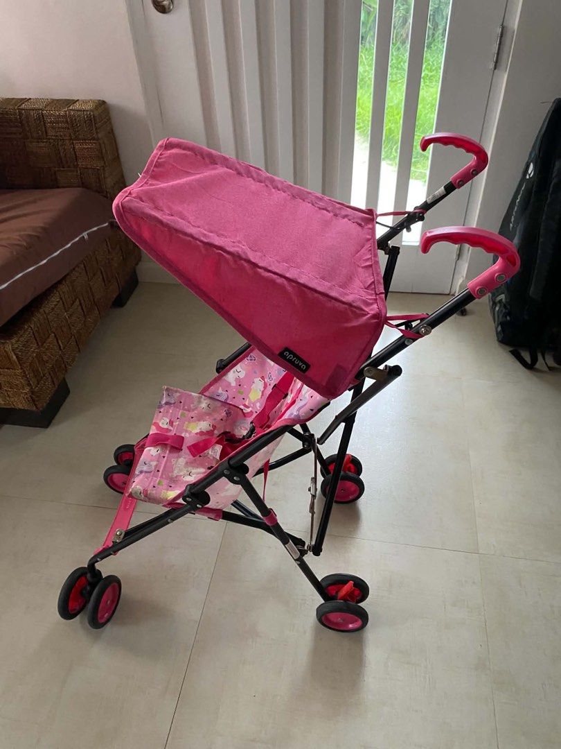 Apruva Pink Unicorn Print Lightweight Stroller (Category: Strollers) located in Manila. Submitted by declutterforamari (Listing ID 1461010313, Image 2). Description: - Adorable pink stroller with a fun unicorn print. - Built-in canopy for sun protection. - Secure 5-point harness for your child's safety. - Folds compactly for easy storage and travel. - Ideal for parents on the go!.
