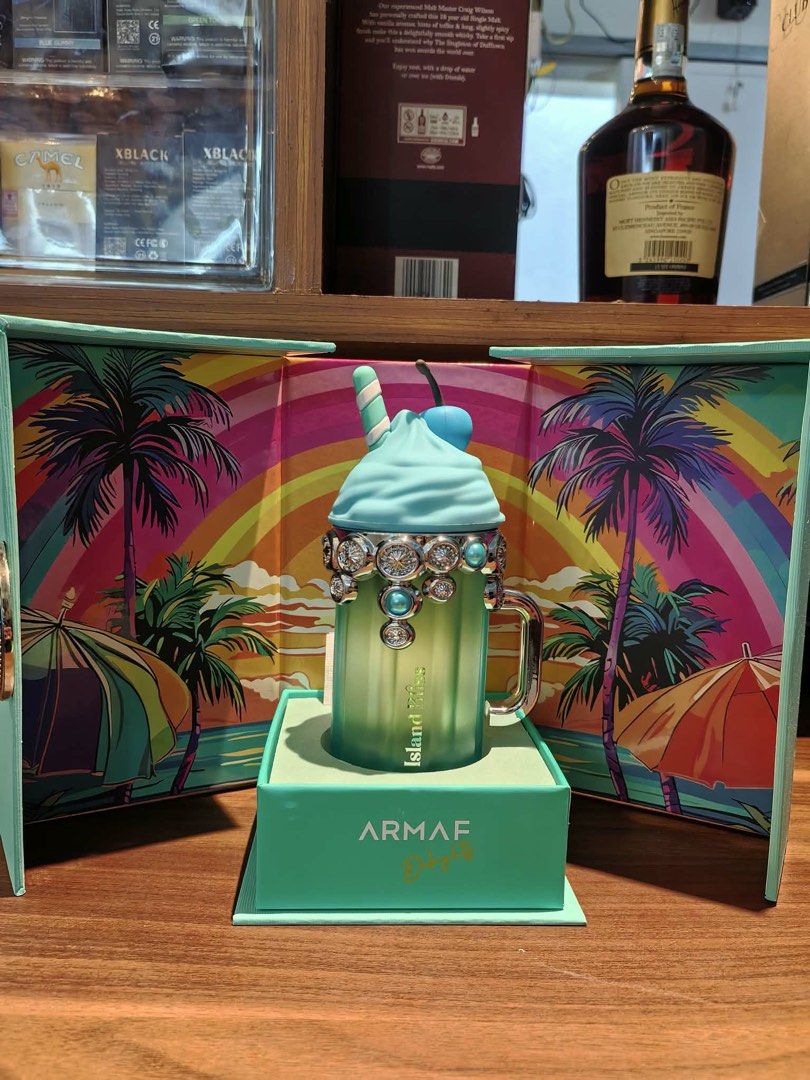 Armaf Island Bliss Perfume (Category: Fragrance & Deodorants) located in Manila. Submitted by mariamicaella24 (Listing ID 1461094776, Image 1). Description: - Adorable milkshake-shaped perfume bottle - Decorated with sparkling gems - Fun tropical packaging featuring palm trees and rainbows - Ideal for perfume collectors or as a unique gift - Includes original box.