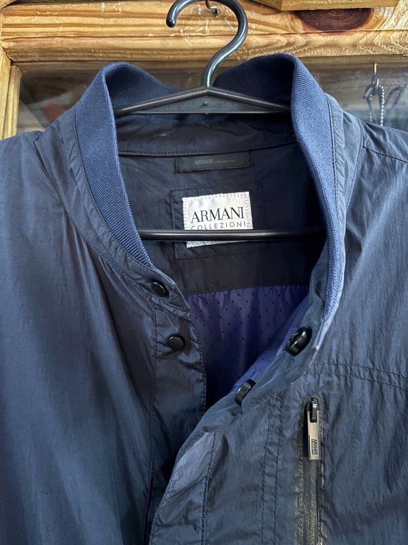 Armani Collezione Water Repellent (Category: Coats, Jackets and Outerwear) located in Baguio. Submitted by thecollector2600 (Listing ID 1460979780, Image 3). Description: Excellent Large 23 x 29 No discoloration. The picture is affected by lighting but no discoloration .
