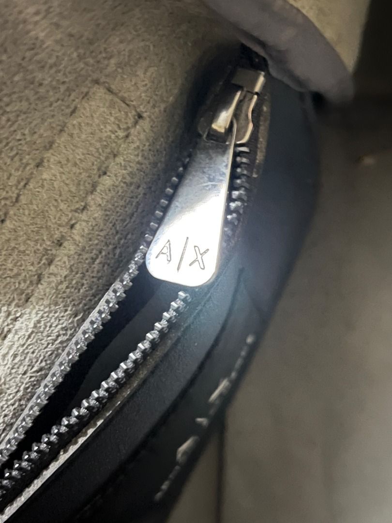 Armani Exchange Tote Bag (Category: Luxury Bags & Wallets) located in Infanta. Submitted by izzy2shop (Listing ID 1461113305, Image 3). Description: - Genuine Armani Exchange black leather tote bag - Main zip compartment for secure storage - Interior zip pocket for essentials - Stylish front flap closure - AX logo zipper pull - Ideal for everyday use.