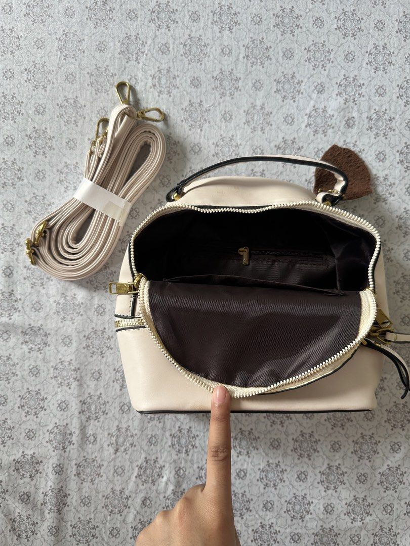 Arnaldo Bassini Chelsea Backpack (Category: Shoulder Bags) located in Quezon City. Submitted by 4k_cam (Listing ID 1460960663, Image 3). Description: - Cream-colored handbag by Arnaldo Bassini - Stylish quilted front detail - Elegant gold zippers - Versatile with top handle and detachable crossbody strap - Interior zippered pocket for essentials 🤍originally: P1998.