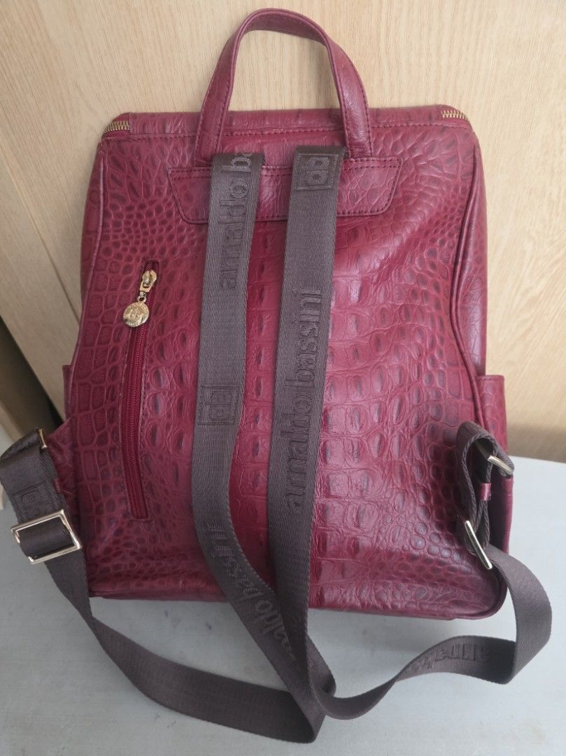ARNALDO BASSINI ITALY BACKPACK (Category: Backpacks) located in Manila. Submitted by yammm23 (Listing ID 1460979840, Image 2). Description: ARNALDO BASSINI ITALY BACKPACK Stylish, elegant, and practical! ❤️ This maroon crocodile-textured backpack is perfect for everyday use, work, school, travel, or casual outings. ✨ Features: 👍Rich maroon/burgundy color 👍Elegant crocodile-embossed texture 👍Spacious main compartment 👍Multiple zippered pockets