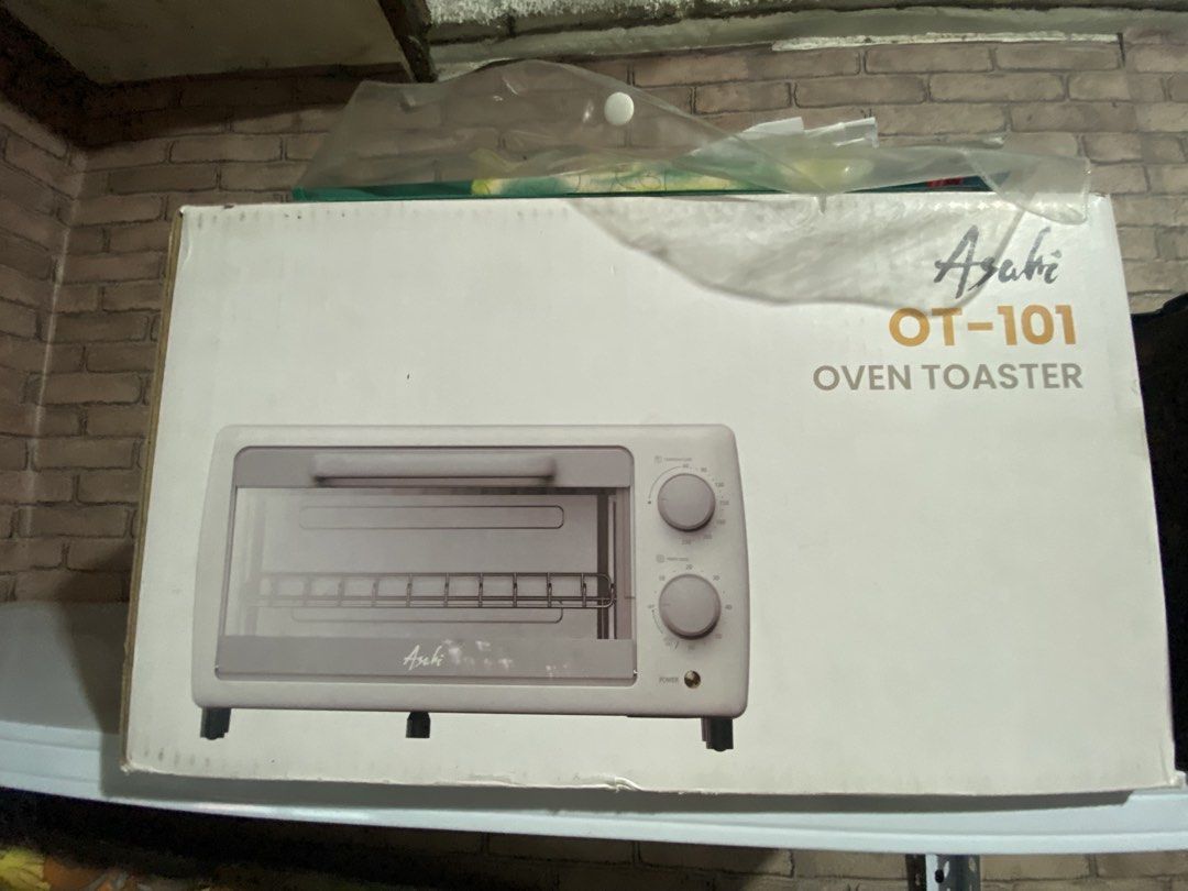 Asahi OT-101 Oven Toaster (Category: Ovens & Toasters) located in Manila. Submitted by jellybbean (Listing ID 1461010127, Image 1). Description: - Asahi OT-101 Oven Toaster - Simple controls: two knobs for temperature and timer - Versatile: ideal for toasting bread, baking small items, and reheating food - Convenient: downward-opening door with baking tray and rack included - Compact: fits easily on kitchen countertops.