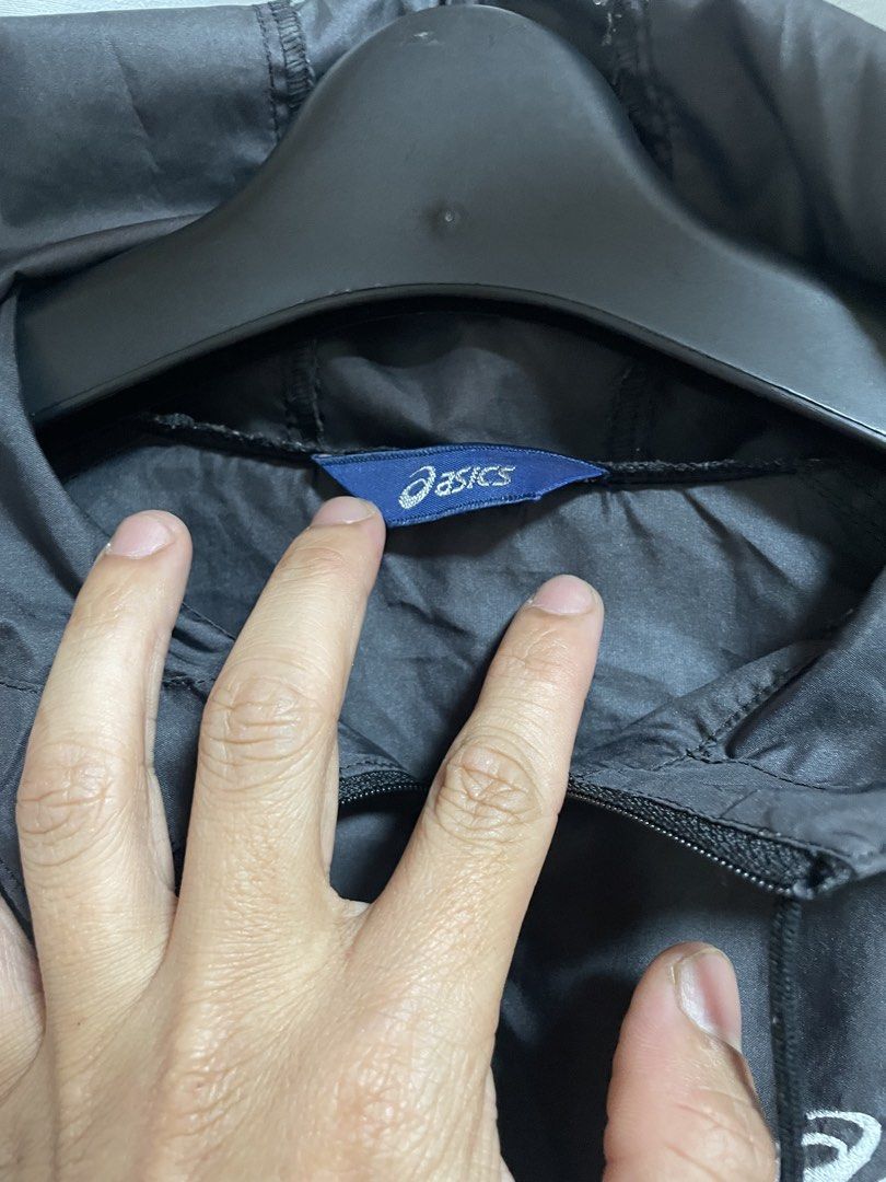 Asics Black Hooded Windbreaker Jacket (Category: Coats, Jackets and Outerwear) located in Lapu Lapu. Submitted by mackoy221524 (Listing ID 1461086737, Image 3). Description: - Black Asics windbreaker jacket - Size: Medium (M) - Features a hood - Half-zip closure - Material: 100% Polyester - Ideal for sports and casual wear - Please check photos for condition details.