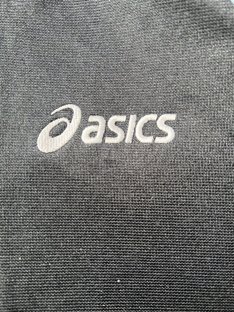 Asics Track Jacket (Category: Coats, Jackets and Outerwear) located in Borongan. Submitted by thriftsbyblas (Listing ID 1460932461, Image 2). Description: - Classic Asics track jacket - Color: Black with white and light blue sleeve/collar accents - Full zip front with pockets - Features a durable YKK zipper - Ideal for sports or casual wear.