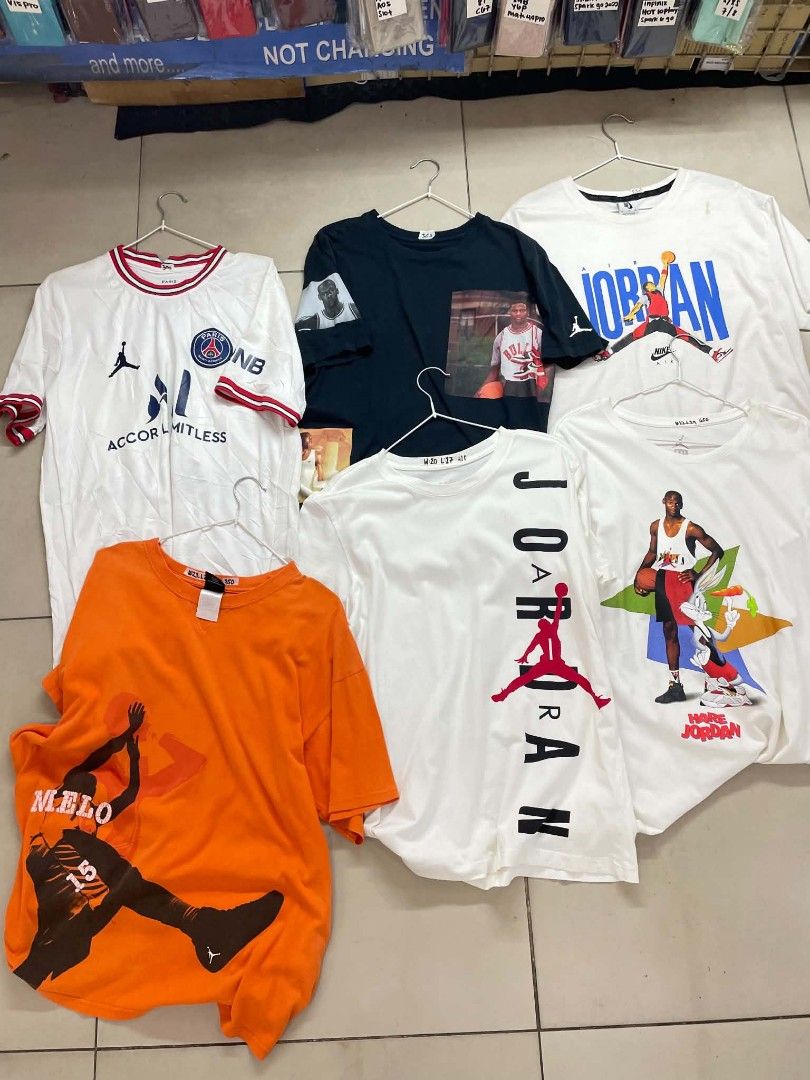 Assorted Graphic T-shirts - Jordan, PSG, Melo (Category: Tshirts & Polo Shirts ) located in Cainta. Submitted by mariss.luxx (Listing ID 1461048260, Image 1). Description: - Bundle of graphic tees - Includes Paris Saint-Germain jersey style shirt - Several Michael Jordan graphic tees, one featuring Bugs Bunny - Includes a Carmelo Anthony (Melo) graphic tee - Ideal for basketball and football fans - All shirts are short-sleeved - Various sizes and