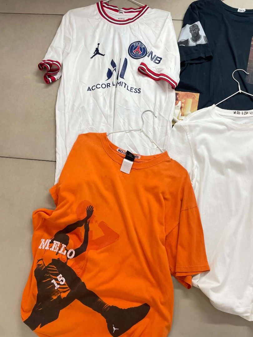 Assorted Graphic T-shirts - Jordan, PSG, Melo (Category: Tshirts & Polo Shirts ) located in Cainta. Submitted by mariss.luxx (Listing ID 1461048260, Image 3). Description: - Bundle of graphic tees - Includes Paris Saint-Germain jersey style shirt - Several Michael Jordan graphic tees, one featuring Bugs Bunny - Includes a Carmelo Anthony (Melo) graphic tee - Ideal for basketball and football fans - All shirts are short-sleeved - Various sizes and