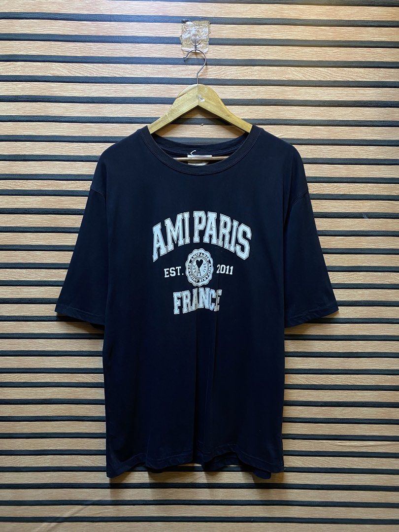 AUTHENTIC AMI PARIS “FRANCE” (Category: Tshirts & Polo Shirts ) located in Makati City. Submitted by drip.poww (Listing ID 1461100781, Image 1). Description: - Authentic Ami Paris - Color: Black - Size: Large - Dimes: 23x28 - Authentic - Excellent condition - Need wash, fresh from bale - Material: 100% Cotton Please don’t expect too much—these are thrifted (ukay) items. 😊 !!STILL NEGOTIABLE!!.