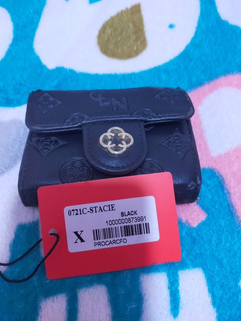 Authentic CLN Stacie Card Wallet (Category: Luxury Bags & Wallets) located in Quezon City. Submitted by zeascloset (Listing ID 1460972154, Image 2). Description: Looking for a cute and practical wallet? This one's for you! 🖤 The elegant black finish paired with its eye-catching gold-tone clasp gives it a classy look, while its spacious interior keeps your cards, cash, coins, and essentials organized..