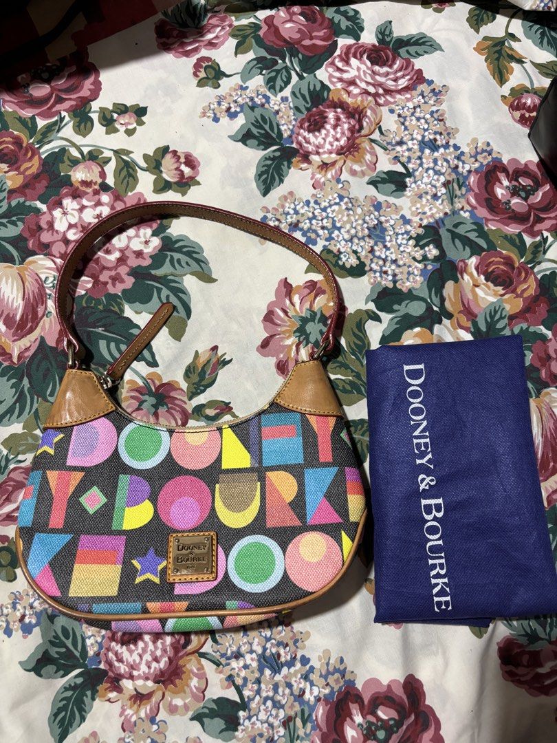 Authentic Dooney & Bourke Art Deco Luna Hobo Bag (Category: Luxury Bags & Wallets) located in Quezon City. Submitted by jhaediah (Listing ID 1461059019, Image 1). Description: Authentic Preloved with dustbag With signs of used.