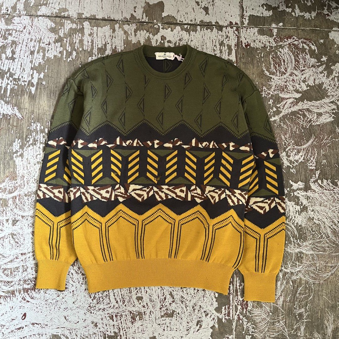 BALENCIAGA 80S KNITTED LS (Category: Hoodies) located in Iloilo. Submitted by plugsta (Listing ID 1461012180, Image 1). Description: olive green knit sweater with a geometric triangle pattern and a Balenciaga Sports label. MEASUREMENT: 21W/26L 22 IN SLEEVE LENGTH DETAILS POSTED .