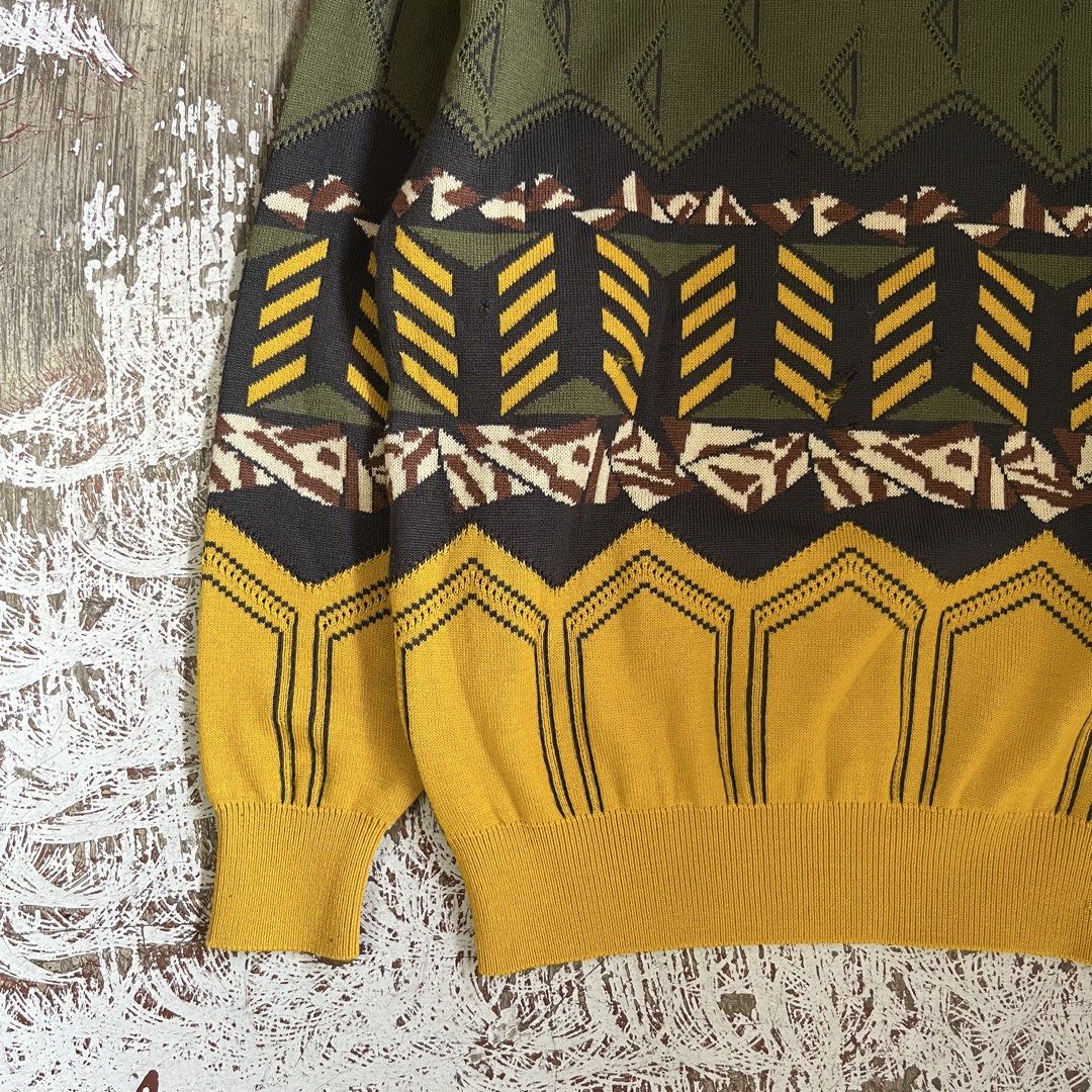 BALENCIAGA 80S KNITTED LS (Category: Hoodies) located in Iloilo. Submitted by plugsta (Listing ID 1461012180, Image 3). Description: olive green knit sweater with a geometric triangle pattern and a Balenciaga Sports label. MEASUREMENT: 21W/26L 22 IN SLEEVE LENGTH DETAILS POSTED .