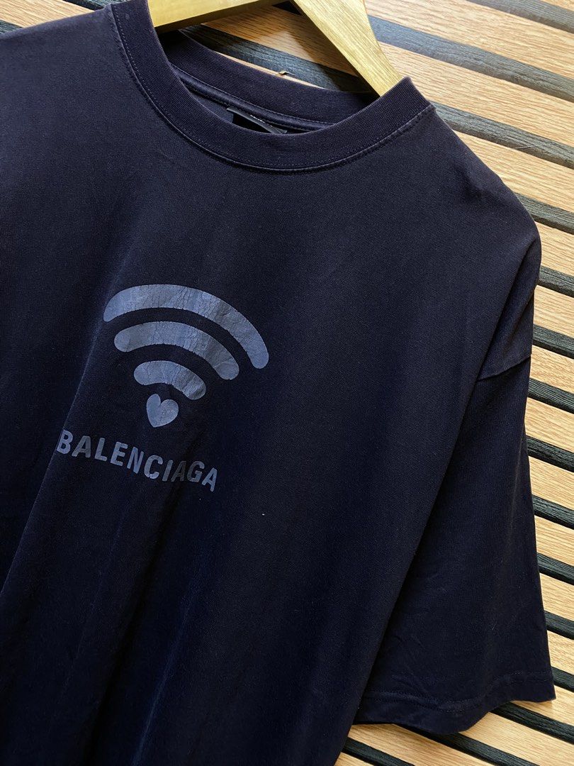 BALENCIAGA “WIFI TEE” (Category: Tshirts & Polo Shirts ) located in Makati City. Submitted by drip.poww (Listing ID 1461091407, Image 2). Description: - Authentic Balenciaga - Color: Black - Size: XL - Dimes: 25x31 - Authentic - Excellent condition - Need wash, fresh from bale - Material: 100% Cotton Please don’t expect too much—these are thrifted (ukay) items. 😊 !!STILL NEGOTIABLE!!.