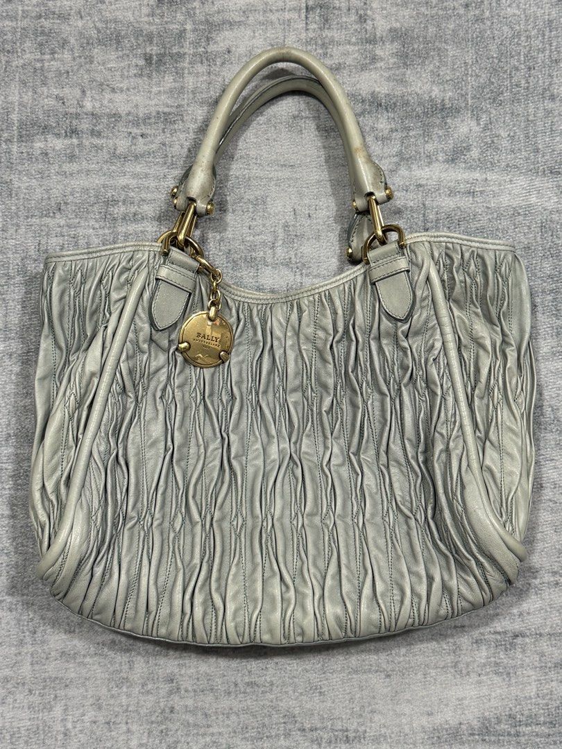 Bally - Ruched Leather Shoulder Bag (Category: Luxury Bags & Wallets) located in Manila. Submitted by members-only (Listing ID 1461079283, Image 2). Description: Vintage Bally Ruched Leather Shoulder Bag Gold Hardware Made In Italy In good condition Flaws: stain in handle strap only (check pics) No issue Authentic & Presentable Can send more pics thru direct message.