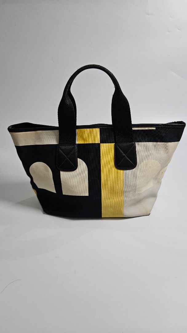Bally leather Tote Bag (Category: Tote Bags) located in Alfonso. Submitted by jbcamet (Listing ID 1461033524, Image 1). Description: - Cool geometric print tote bag - Colors: Cream, yellow, and black - Black handles - Durable canvas-like material - Ideal size for everyday use - Perfect for carrying your essentials - Simple and stylish design.