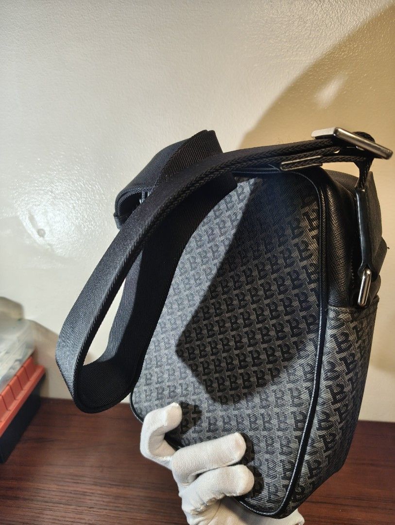 Bally Monogram Black Crossbody Bag (Category: Luxury Bags & Wallets) located in Makati City. Submitted by kimmyscabinet (Listing ID 1461081382, Image 2). Description: - Authentic Bally crossbody bag - All-over signature Bally monogram pattern - Black leather trim and adjustable strap - Silver hardware and zipper closure - Classic design, ideal for everyday wear - Bally logo clearly visible on the front - In very good condition.