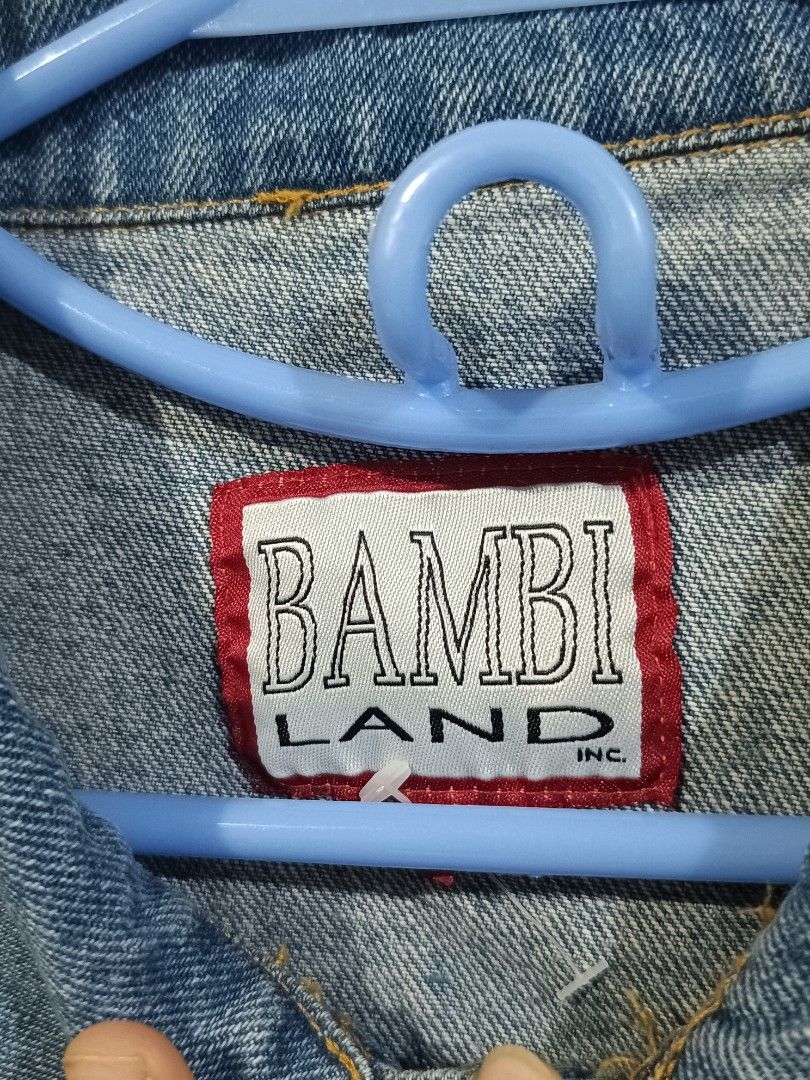 Bambi Land Inc. Blue Denim Jacket (Category: Coats, Jackets and Outerwear) located in Manila. Submitted by dear__riri__ (Listing ID 1461003318, Image 2). Description: - Classic blue denim jacket - Brand: Bambi Land Inc. - Button-up front - Two chest pockets - Long sleeves with button cuffs - Standard fit - Ideal for layering - Versatile and easy to style.