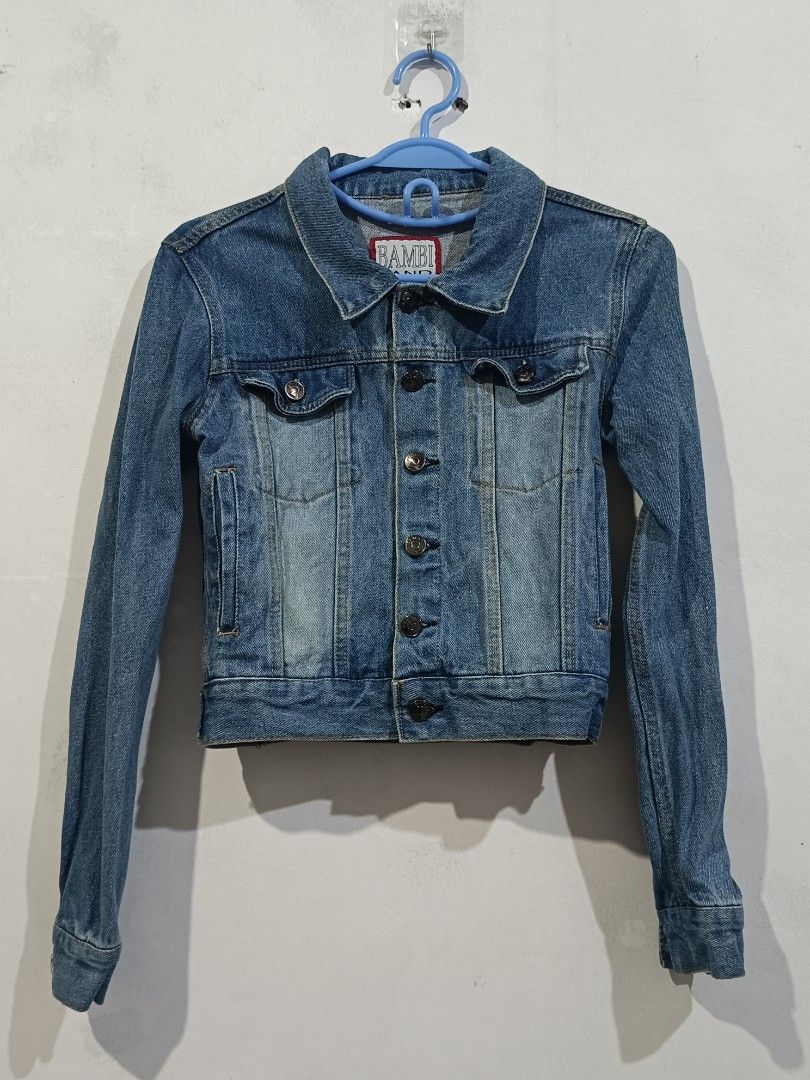 Bambi Land Inc. Blue Denim Jacket (Category: Coats, Jackets and Outerwear) located in Manila. Submitted by dear__riri__ (Listing ID 1461003318, Image 1). Description: - Classic blue denim jacket - Brand: Bambi Land Inc. - Button-up front - Two chest pockets - Long sleeves with button cuffs - Standard fit - Ideal for layering - Versatile and easy to style.