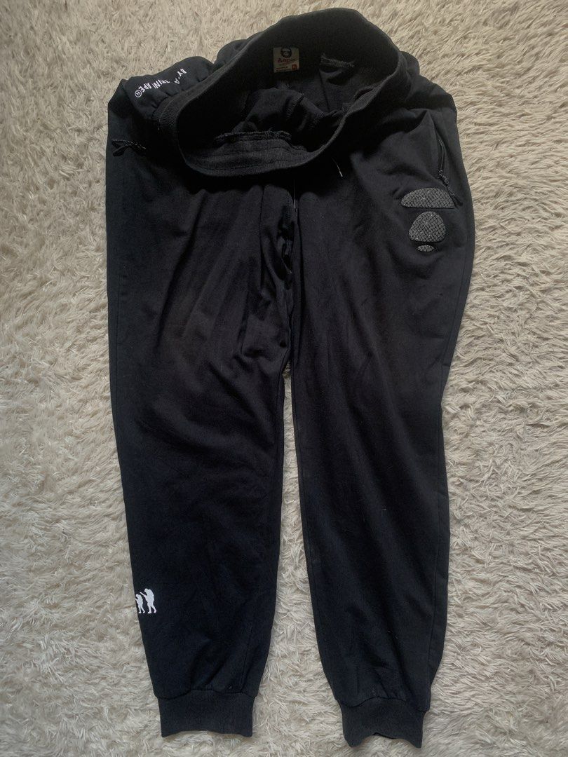 BAPE Black Jogger Pants (Category: Joggers) located in General Santos City (Dadiangas). Submitted by thrifty_gsc (Listing ID 1461022368, Image 1). Description: - Authentic Black BAPE Jogger Pants - Signature BAPE Camo Print Detail on Sides - BAPE Logo Accent on Leg - Comfortable Elastic Waistband with Drawstring - Convenient Side Pockets - Relaxed and Comfortable Fit.
