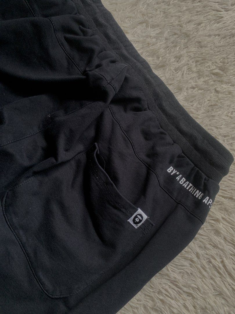 BAPE Black Jogger Pants (Category: Joggers) located in General Santos City (Dadiangas). Submitted by thrifty_gsc (Listing ID 1461022368, Image 2). Description: - Authentic Black BAPE Jogger Pants - Signature BAPE Camo Print Detail on Sides - BAPE Logo Accent on Leg - Comfortable Elastic Waistband with Drawstring - Convenient Side Pockets - Relaxed and Comfortable Fit.