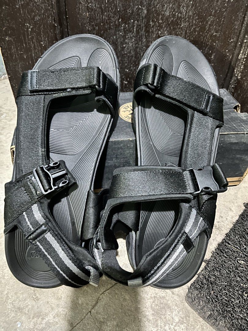Bass Unisex Black Adjustable Strap Sandals (Category: Slippers & Slides) located in Manila. Submitted by pingfed (Listing ID 1461092736, Image 1). Description: - Unisex; US size 12 - Black Bass sandals - Adjustable straps for a secure fit - Durable sole with excellent grip pattern - Comfortable for all-day walking - Perfect for casual outings or outdoor adventures .