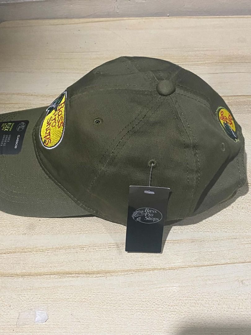 Bass Pro Shops Twill Cap. (Category: Caps & Hats) located in Quezon City. Submitted by carlos132 (Listing ID 1461093154, Image 2). Description: - Bass Pro Shops classic logo patch (bass + lure). - Olive cotton-twill front, matching mesh back. - Adjustable snapback (Swoosh Flex) - M/L. - Brand new with tags..